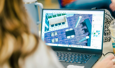 Person working on interior design plan using software